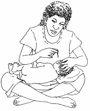 When the child is used to tissue spearing, they can lie on their side in the carer's lap.